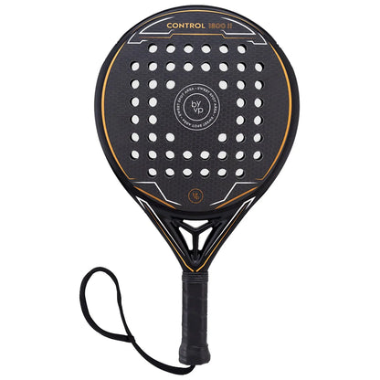 A padel racket with a round shape features a textured black surface dotted with holes and an orange outline alongside a black grip and wrist strap designed for controlled play in sports contexts.