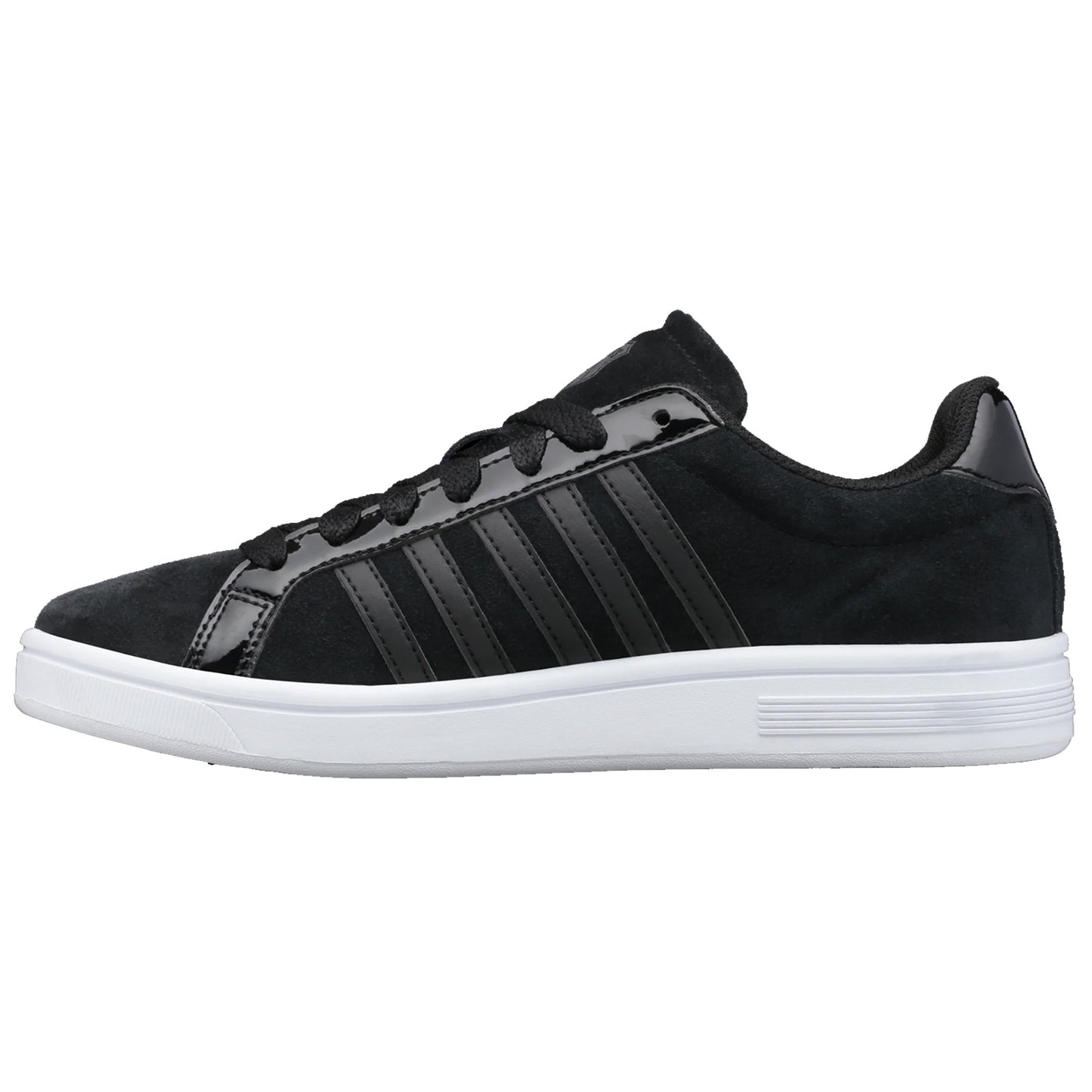 A black sneaker features a smooth upper with glossy stripes and a white sole while positioned on a neutral background showcasing its sleek design intended for casual wear.