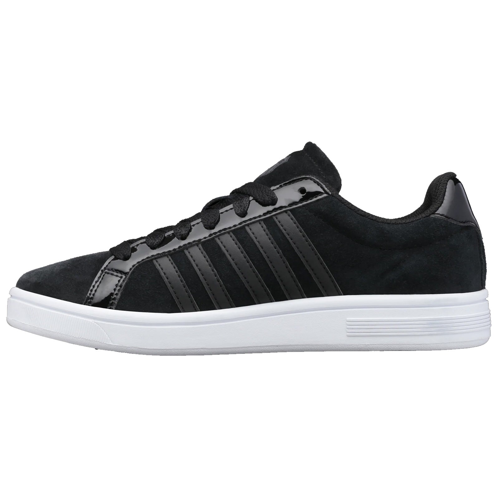 A black sneaker features a smooth upper with glossy stripes and a white sole while positioned on a neutral background showcasing its sleek design intended for casual wear.