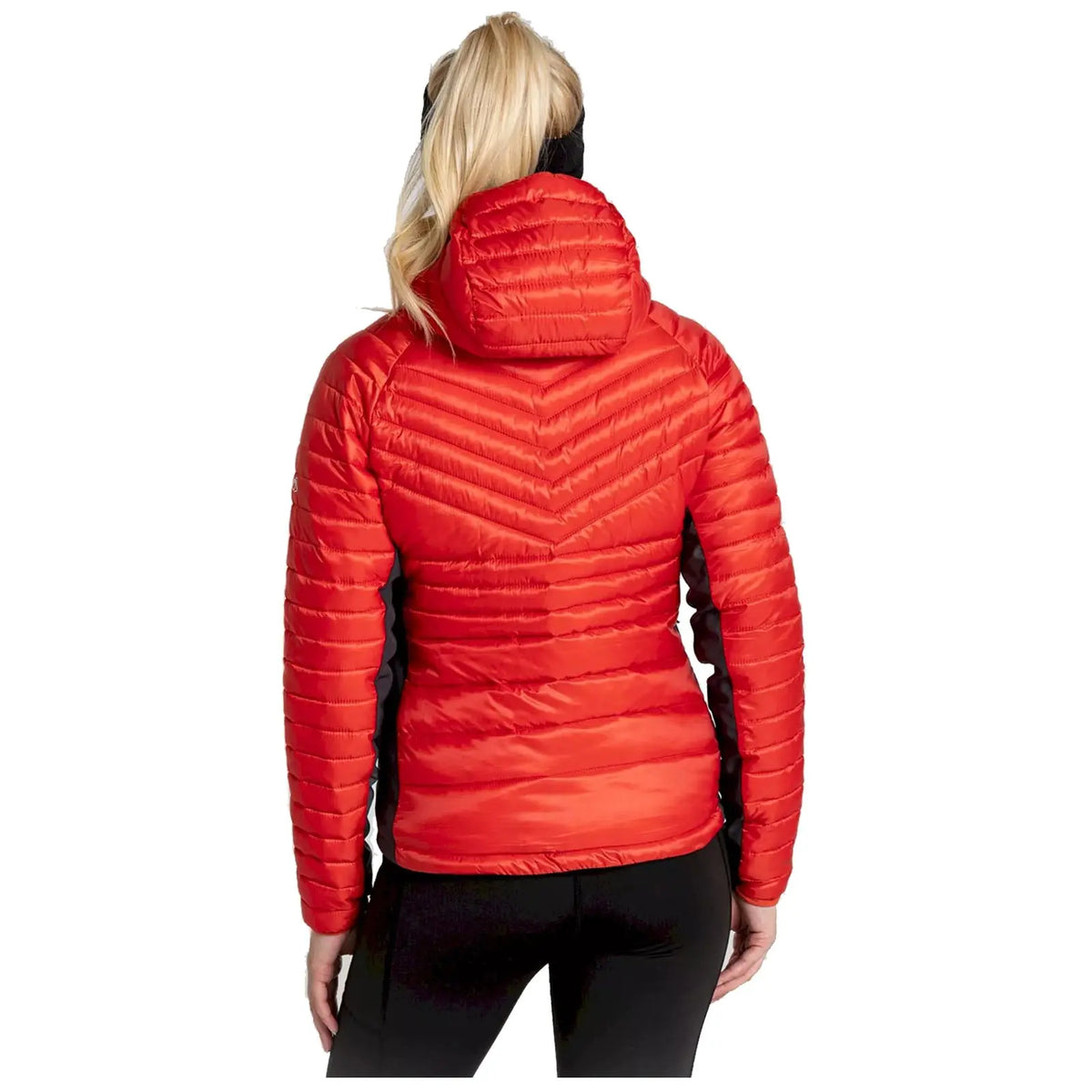 A woman is wearing a red puffy jacket with a hood facing away from the viewer, showcasing the jacket's textured design and vibrant color against a plain background.