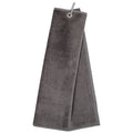 A gray towel hangs from a metal ring attached to its corner in a neutral setting suggesting use in a bathroom or kitchen environment. The towel is soft and absorbent.