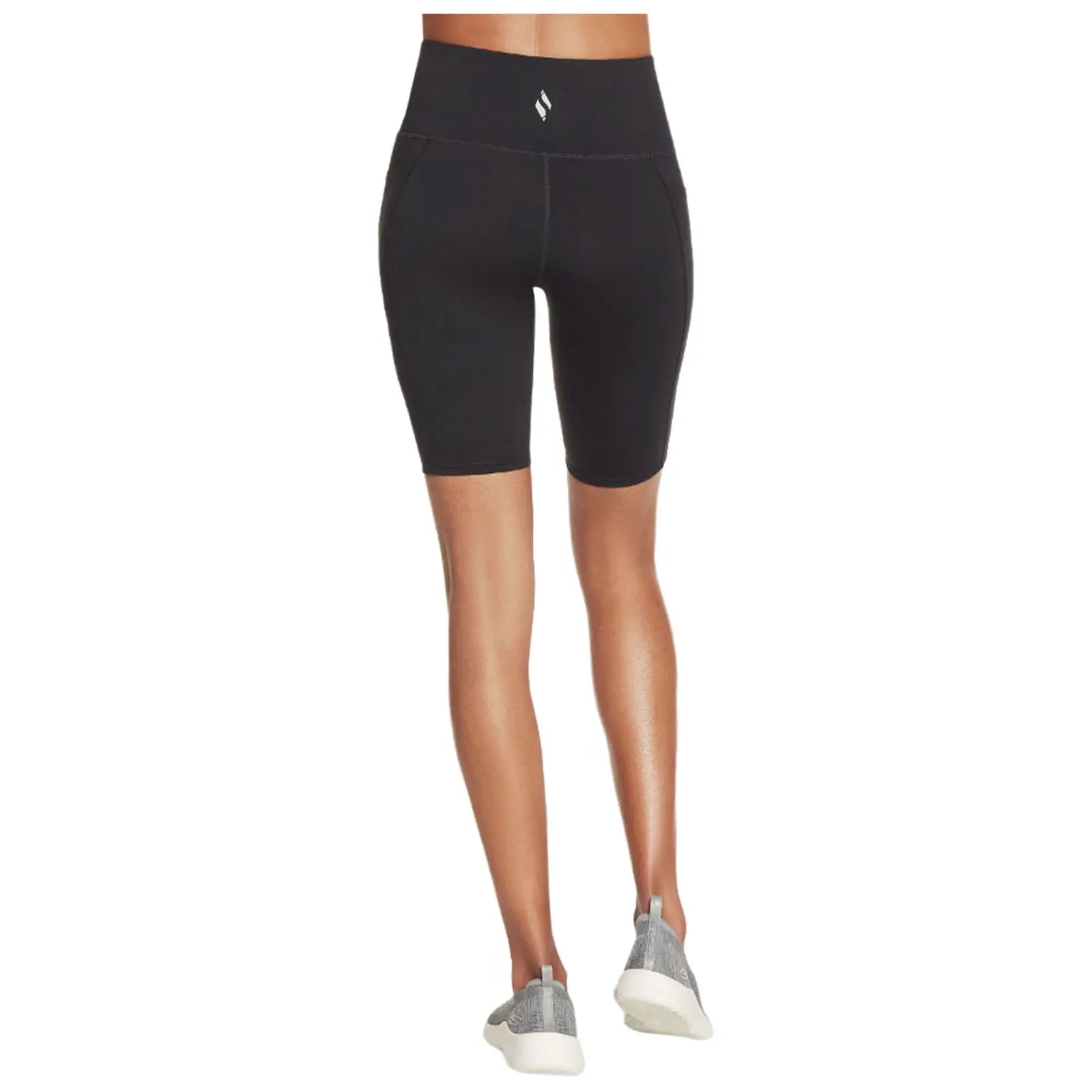 Black high-waisted biker shorts fitted snugly around the thighs with a supportive waist band are worn by a person standing still in a neutral setting.