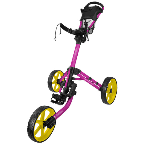 A pink and yellow golf push cart stands upright with three large wheels and a handle. It is designed for transporting golf bags on a course.