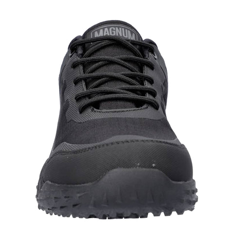 A black athletic shoe is centered in the image featuring a textured upper and a rugged sole designed for traction showcasing a logo on the tongue reading MAGNUM.