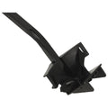 A black plastic kitchen tool with a long handle and a wide grip at the end is designed to assist in lifting or holding food items securely in place.
