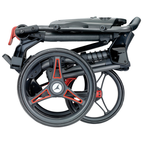 A black and red folding wheelchair is stacked compactly with its wheels arranged neatly beneath the seat structure showcasing its portability and design in a neutral background