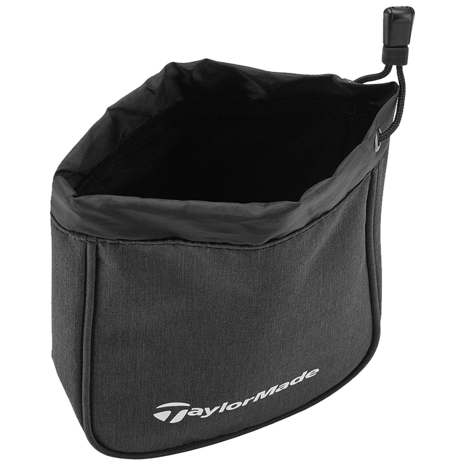 A black fabric golf accessory bag stands upright showcasing its open top and soft interior the TaylorMade logo is printed prominently on one side