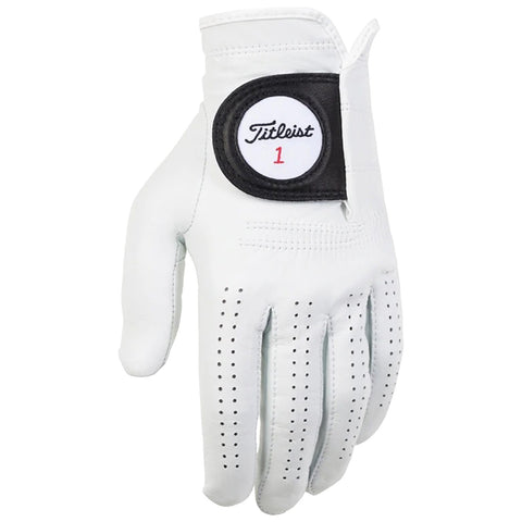 A white golf glove rests with fingers slightly spread showcasing a leather texture and ventilation holes featuring a black patch with the Titleist logo and number 1 on the wrist area.