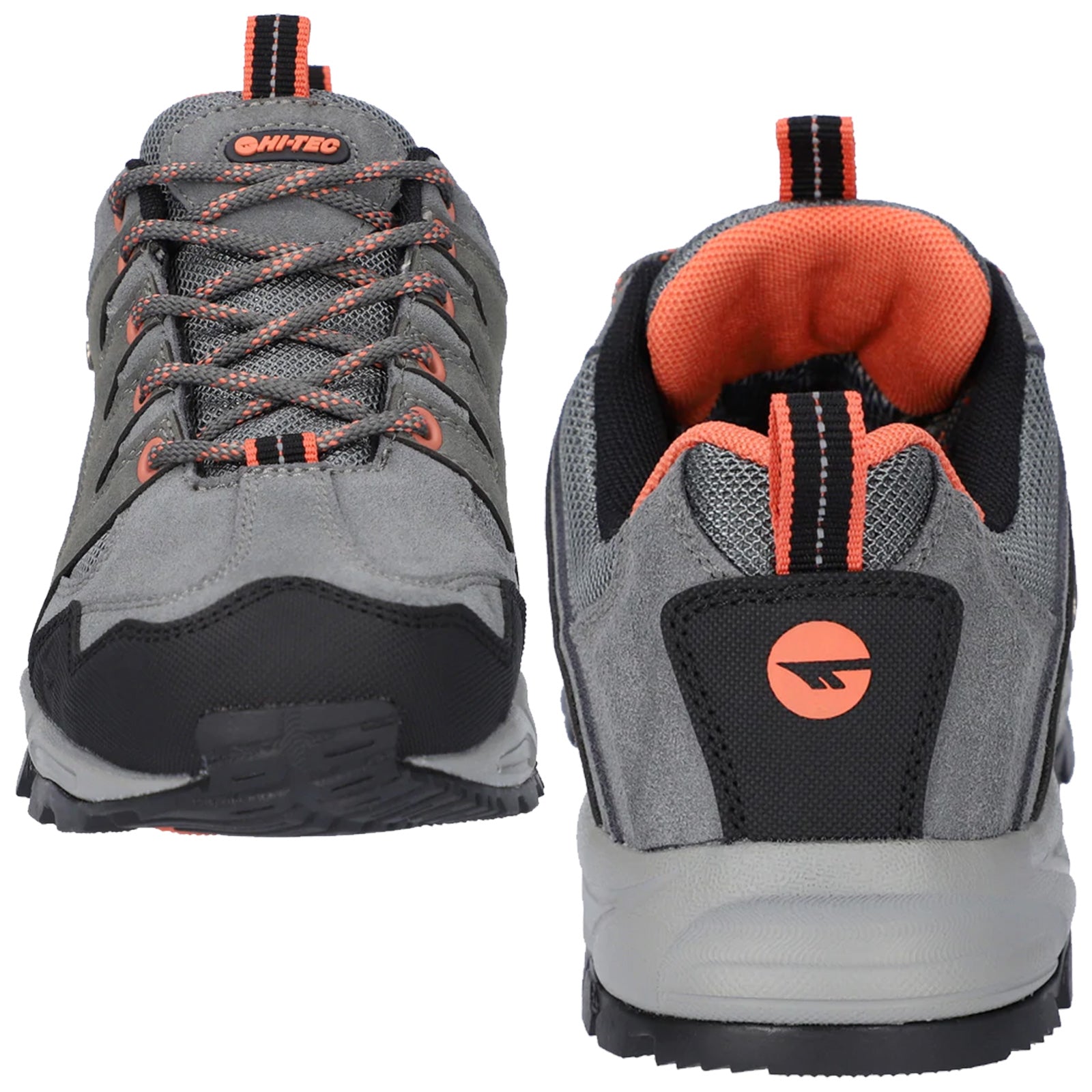 A pair of gray hiking shoes features orange accents and black detailing. The shoes are positioned with one facing forward and the other highlighting the back view, set against a plain background.