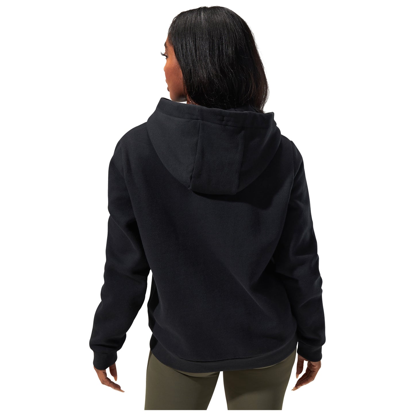 A person wearing a black hooded sweatshirt stands with their back facing the viewer their long hair cascades over the collar in a plain white background.