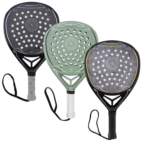 Three padel rackets are displayed, each with a distinct design and color. They are positioned with handles facing downward, showcasing their perforated faces and string patterns against a neutral background.