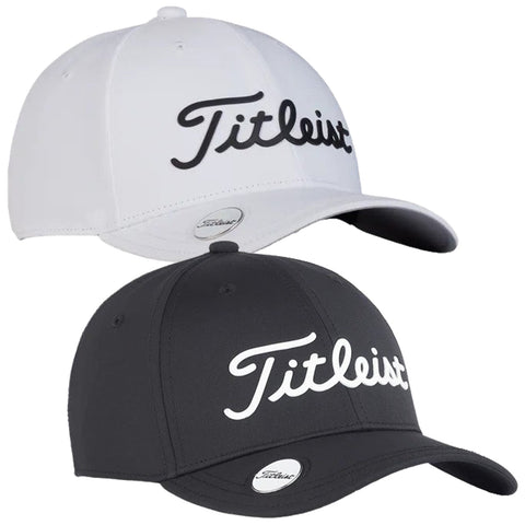 Two baseball caps are displayed stacked with the top one being white and the bottom one black both featuring the logo Titleist prominently on the front in contrasting colors.