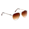 Metal framed sunglasses with gradient brown lenses resting at an angle the reflective tint suggests a bright outdoor environment suitable for shielding eyes from sunlight