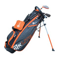 A black and orange golf bag stands upright featuring a shoulder strap and legs The bag holds golf clubs and has multiple zippered pockets for storage
