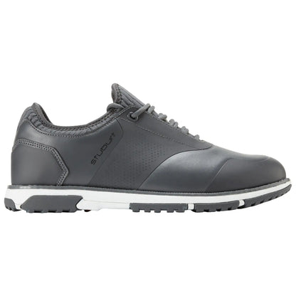 A grey shoe designed for walking features a sleek finish and textured accents with a white midsole and black rubber outsole situated on a plain white background.