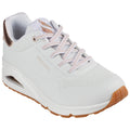 A white sneaker with light pink accents is positioned at a slight angle showcasing its perforated design and textured sole while displaying the brand name on the side