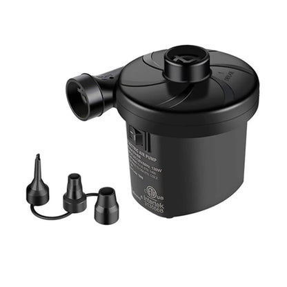 A compact black electric air pump is positioned upright with multiple nozzle attachments nearby intended for inflating items in a household or outdoor setting.
