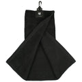 A black towel is hanging with a clip at the top and is partially folded showing its textured surface it is likely intended for use in a golf context