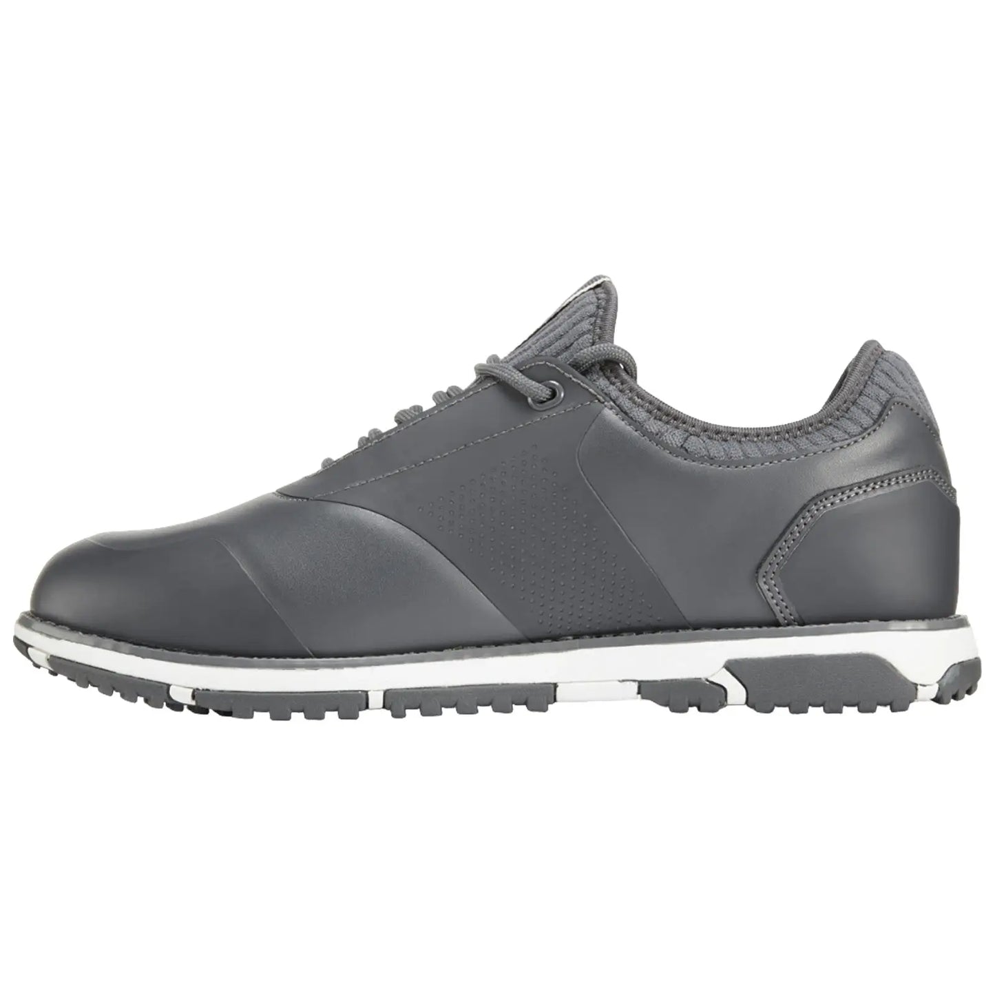 A gray athletic shoe sits on a flat surface featuring a smooth leather upper and textured accents with a white midsole and a patterned rubber outsole designed for traction.