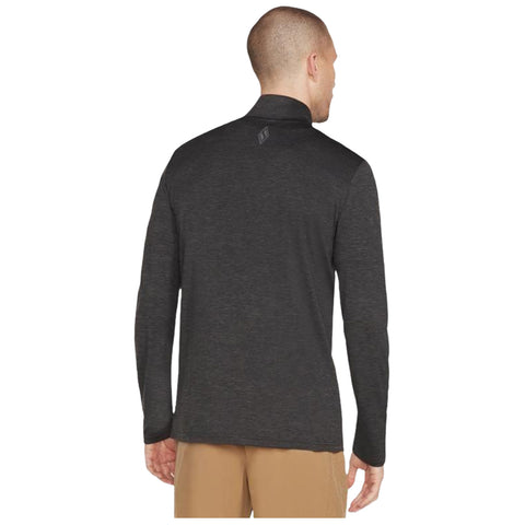 A person is wearing a long-sleeve dark garment with a high collar facing away from the viewer in a neutral background suggesting indoor lighting and casual wear.