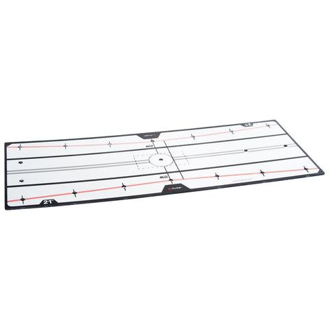 A large white training board is lying flat with black and red lines marking a sports field layout featuring circles and directional arrows in an indoor setting.