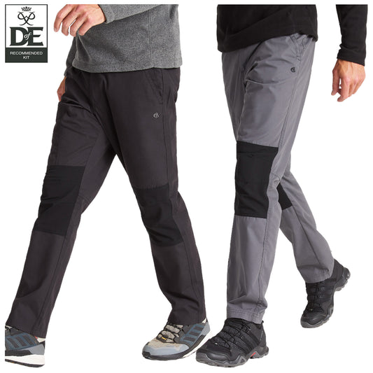 Two pairs of outdoor pants are displayed side by side, one black and one gray. Each pair features contrasting patches and is worn by figures in hiking shoes, suggesting an active outdoor context.